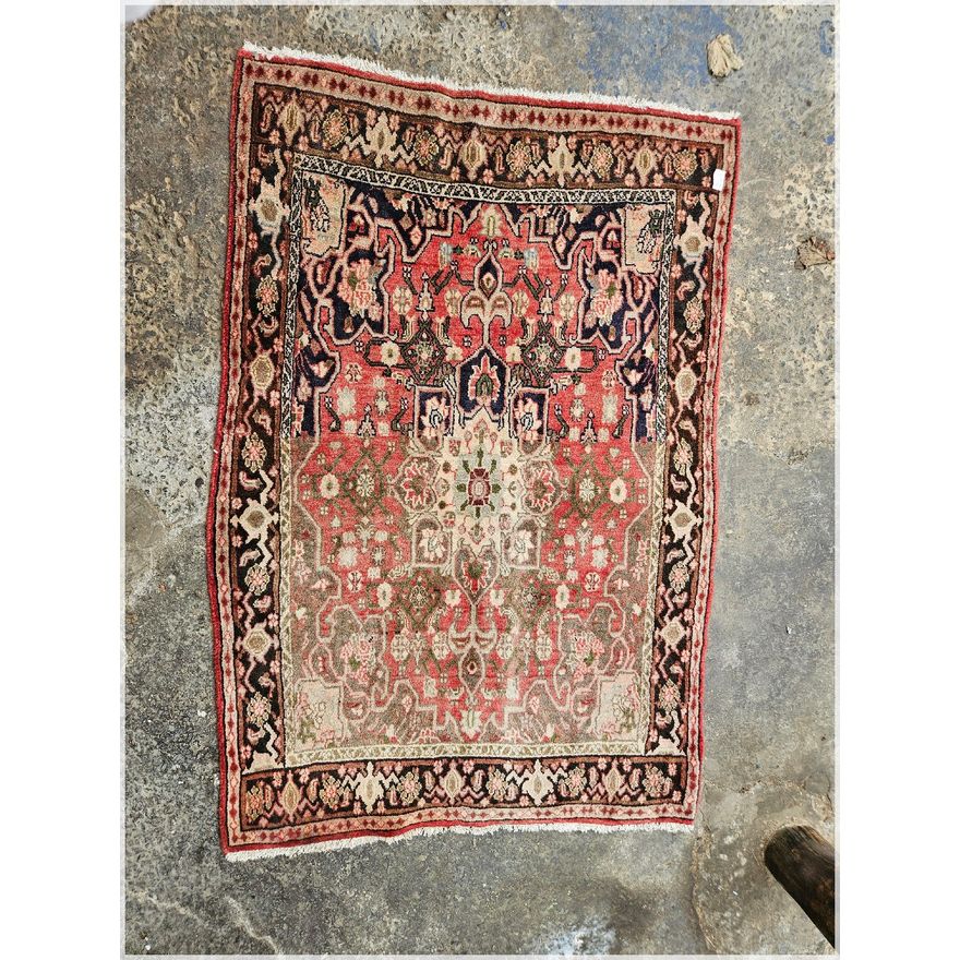 Small worn Persian carpet